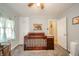 Bedroom with a crib, storage and a ceiling fan and natural light from the window at 4203 Main St, Anderson, IN 46013