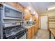 Updated kitchen featuring stainless steel appliances, lots of cabinets, and a window above the sink at 4203 Main St, Anderson, IN 46013