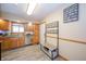 Functional kitchen featuring wood cabinetry, stainless steel appliances, and a convenient entryway at 4203 Main St, Anderson, IN 46013