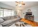 Relaxing living room showcasing a comfortable sofa, hardwood floors, and a modern entertainment center at 4203 Main St, Anderson, IN 46013