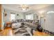 Comfortable living room with a large sectional sofa, stylish rug, and ample natural light at 4203 Main St, Anderson, IN 46013