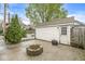 Backyard featuring a fire pit, garage, and a grassy area perfect for entertaining at 4575 N Guilford Ave, Indianapolis, IN 46205