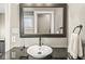 Bathroom vanity with dark countertop, large mirror, and decor at 4575 N Guilford Ave, Indianapolis, IN 46205