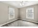 Bright bedroom featuring two windows and a ceiling fan at 4575 N Guilford Ave, Indianapolis, IN 46205