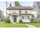 Charming two-story home with landscaped yard and inviting front porch at 4575 N Guilford Ave, Indianapolis, IN 46205