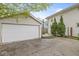 View of the detached garage and rear of home from the backyard at 4575 N Guilford Ave, Indianapolis, IN 46205