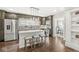 A kitchen showcases granite countertops, stainless steel appliances, a stylish island with seating, and an open layout at 4575 N Guilford Ave, Indianapolis, IN 46205