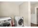 Bright laundry room featuring modern washing machine and dryer at 4575 N Guilford Ave, Indianapolis, IN 46205
