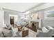 Inviting living room with fireplace and seamless flow to the entry way at 4575 N Guilford Ave, Indianapolis, IN 46205