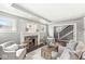 Bright living room featuring a stone fireplace and comfortable seating at 4575 N Guilford Ave, Indianapolis, IN 46205