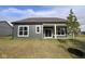 Charming home featuring gray siding, white trim, large windows and a covered patio perfect for outdoor enjoyment at 5052 Carmine St, Brownsburg, IN 46112