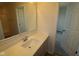 Bright bathroom featuring a large mirror, white quartz countertop, and modern fixtures at 5052 Carmine St, Brownsburg, IN 46112