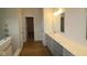 Modern bathroom with a long vanity, bright countertop, and decorative mirrors at 5052 Carmine St, Brownsburg, IN 46112