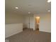 Cozy loft with neutral carpet and view to bathroom at 5052 Carmine St, Brownsburg, IN 46112