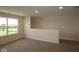 Spacious carpeted room with a large window, providing a relaxing and bright atmosphere at 5052 Carmine St, Brownsburg, IN 46112