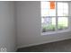 Bright bedroom featuring a large window and neutral carpeting at 5052 Carmine St, Brownsburg, IN 46112