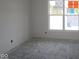 Sun-filled bedroom with big window overlooking the yard at 5052 Carmine St, Brownsburg, IN 46112