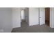 Spacious bedroom features neutral carpeting and multiple open doorways at 5052 Carmine St, Brownsburg, IN 46112