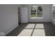 Bright bedroom featuring plush carpeting and a large window with natural light at 5052 Carmine St, Brownsburg, IN 46112
