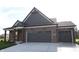 Beautiful home with a red brick exterior and a spacious two-car garage offering modern comfort at 5052 Carmine St, Brownsburg, IN 46112