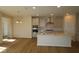 Well-lit kitchen with stainless steel appliances, an island sink, and ample countertop space at 5052 Carmine St, Brownsburg, IN 46112