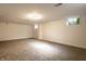 Open basement area featuring carpet and bright overhead lighting at 5130 N Washington Blvd, Indianapolis, IN 46205