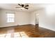 Bedroom with hardwood floors, natural light, and a neutral color palette at 5130 N Washington Blvd, Indianapolis, IN 46205