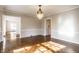 Elegant dining room featuring hardwood floors, a chandelier, and ample natural light at 5130 N Washington Blvd, Indianapolis, IN 46205