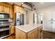 Bright kitchen featuring stainless steel appliances, custom cabinets, and a center island with a quartz countertop at 5130 N Washington Blvd, Indianapolis, IN 46205