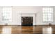 Living room showcases a fireplace and gleaming hardwood floors at 5130 N Washington Blvd, Indianapolis, IN 46205