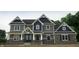 Beautiful two-story home with striking architectural details and a combination of stone and siding at 5179 Oak Ridge Trl, Columbus, IN 47201