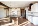 Bright kitchen with a large center island, modern appliances, and ample cabinet space at 5179 Oak Ridge Trl, Columbus, IN 47201