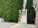 A gate in the backyard surrounded by vibrant greenery adds an element of privacy and charm to the property at 5773 Station Hill Dr, Avon, IN 46123