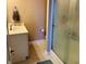 Bathroom featuring vanity with a sink, a shower with glass door, and neutral wall paint at 5773 Station Hill Dr, Avon, IN 46123