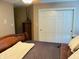 Bedroom featuring carpeted floors, sliding closet doors, and ceiling fan at 5773 Station Hill Dr, Avon, IN 46123