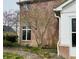 Brick exterior of a home accented by blooming trees, adding a touch of natural beauty at 5773 Station Hill Dr, Avon, IN 46123