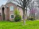 Beautiful two-story brick home with a well-maintained yard and mature trees at 5773 Station Hill Dr, Avon, IN 46123