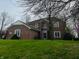 Traditional brick home with a well-manicured lawn and mature trees in a desirable location at 5773 Station Hill Dr, Avon, IN 46123