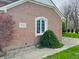 Close-up of brick home with manicured landscaping and charming architectural details at 5773 Station Hill Dr, Avon, IN 46123