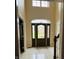 Welcoming foyer featuring tile flooring, a decorative front door, and ample natural light, providing a grand entrance at 5773 Station Hill Dr, Avon, IN 46123