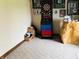 A spacious room with an electronic dart board and unique decor, offering endless opportunities for game night fun at 5773 Station Hill Dr, Avon, IN 46123
