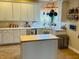 A kitchen with white cabinets, quartz countertops, a butcher block island, and stainless steel appliances at 5773 Station Hill Dr, Avon, IN 46123