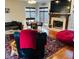 Cozy living room with a fireplace, comfortable seating, and large windows at 5773 Station Hill Dr, Avon, IN 46123