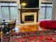 Inviting living room with a fireplace, hardwood floors, and stylish furnishings, ideal for gatherings and relaxation at 5773 Station Hill Dr, Avon, IN 46123