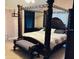 Spacious main bedroom featuring a four poster canopy bed and plush carpet at 5773 Station Hill Dr, Avon, IN 46123
