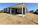 A covered back patio provides the perfect outdoor living space for relaxation and entertainment at 5924 Trichel Dr, Greenwood, IN 46143