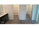 Walk-in closet featuring carpet, wire shelving and a new door at 5924 Trichel Dr, Greenwood, IN 46143