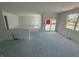 Unfinished living room with bright light and sliding doors to backyard is ready to customize at 5924 Trichel Dr, Greenwood, IN 46143