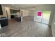 Spacious open-concept living area with dark wood floors, recessed lighting and glass sliding doors to patio at 5924 Trichel Dr, Greenwood, IN 46143
