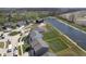 Aerial view showing the property line, neighborhood layout, and community lake, emphasizing outdoor and community aspects at 613 Waterford Ln, Westfield, IN 46074